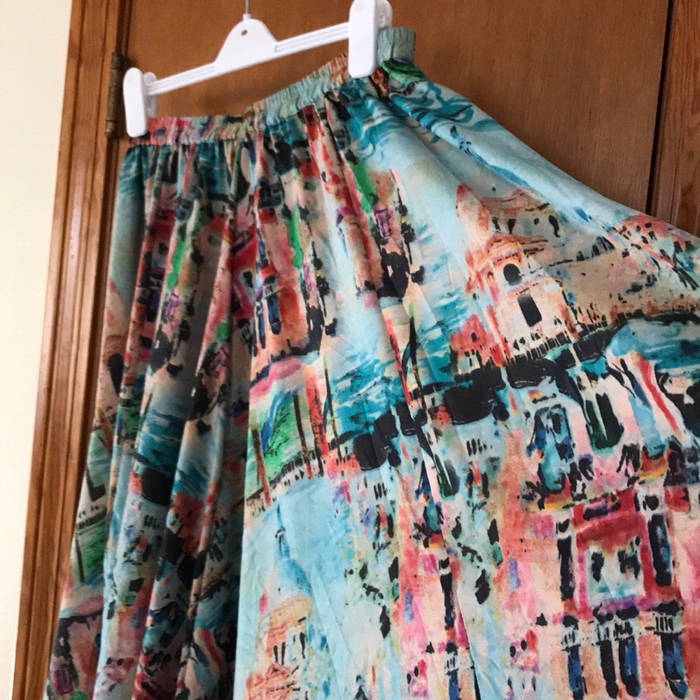 Full length, flared skirt, impressionist style.